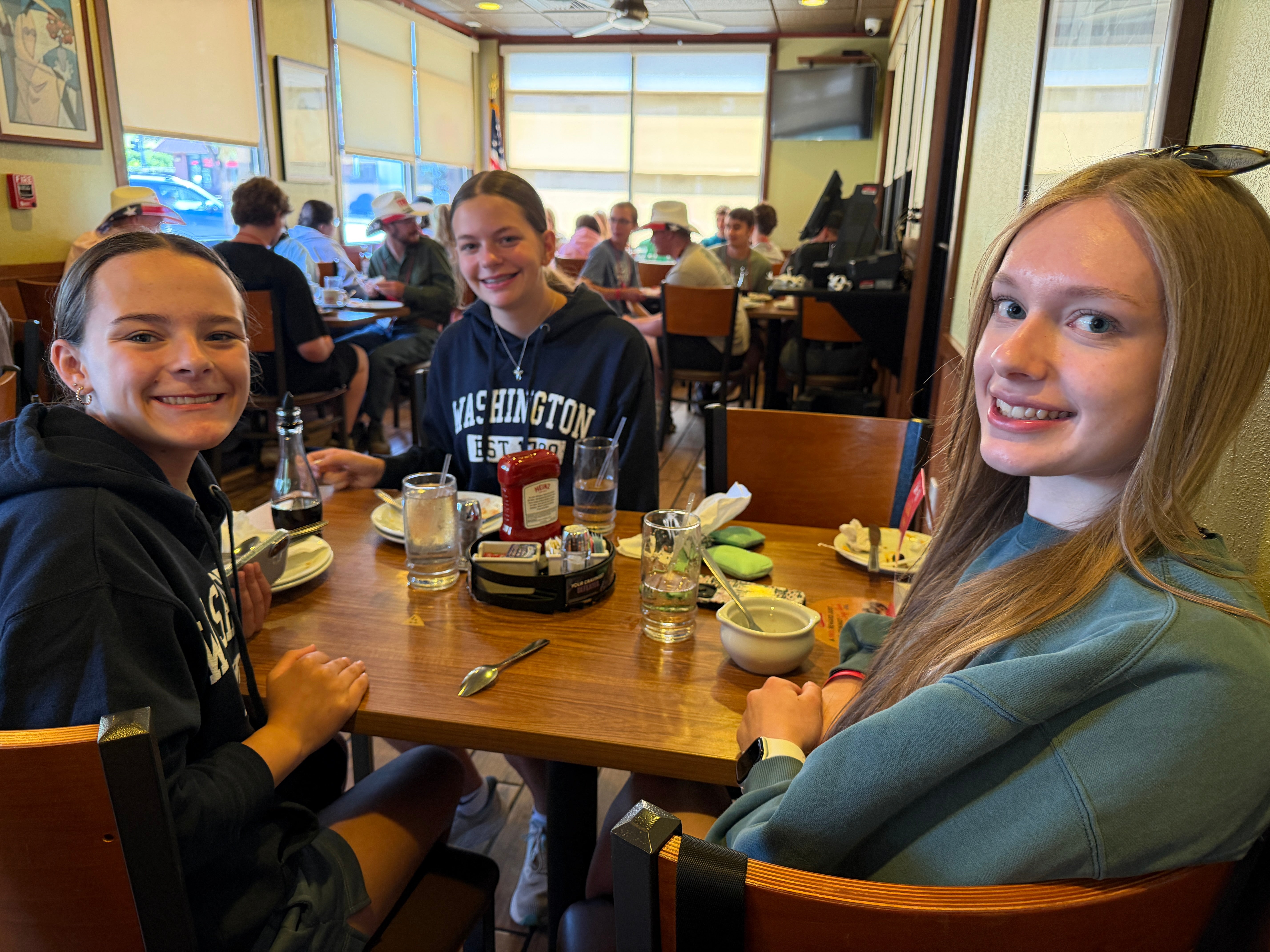 Students posing at a diner