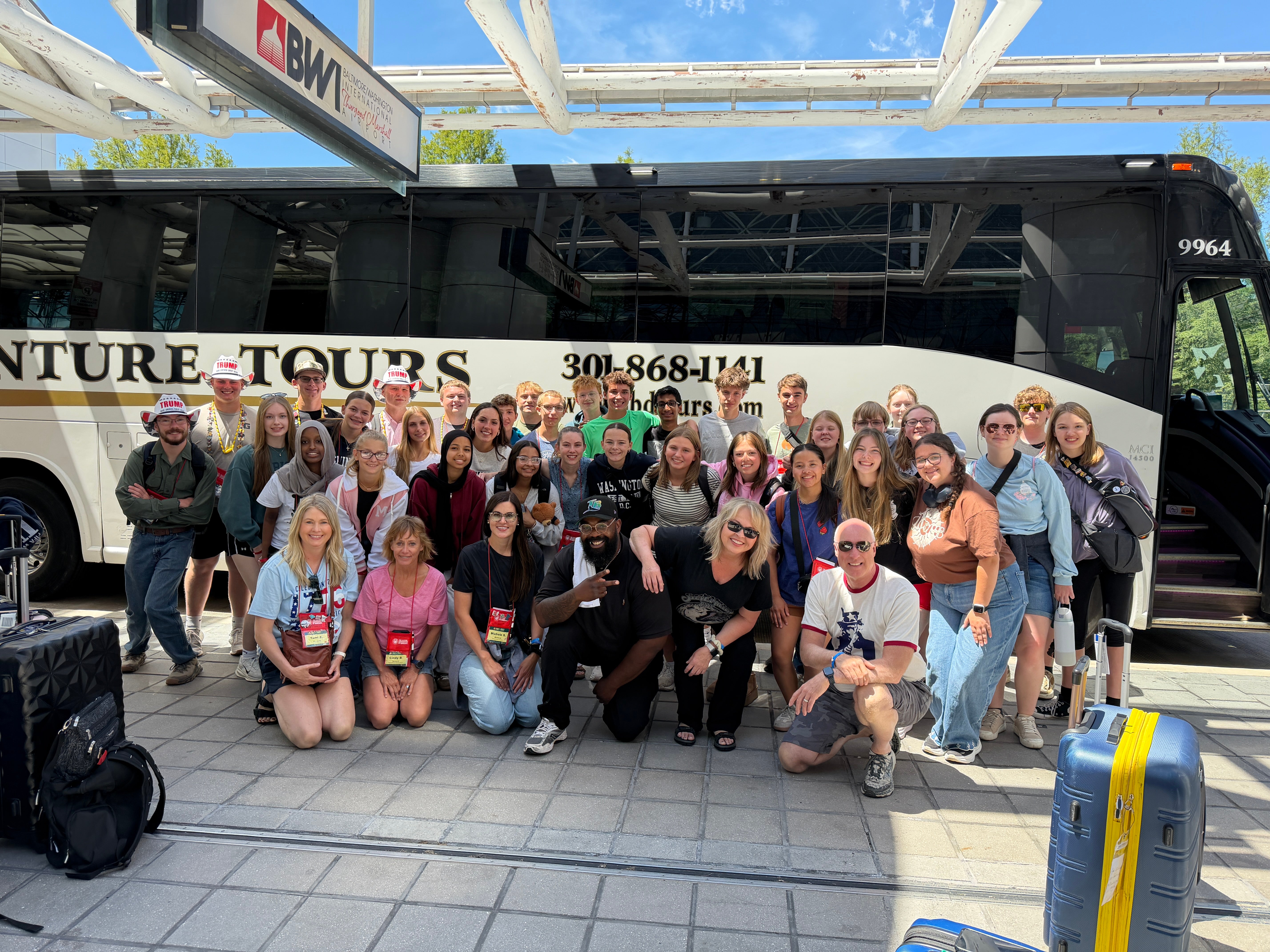 students outside a coach bus