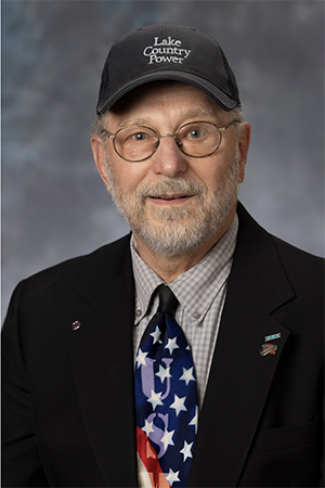 Mike Forsman in LCP hat, American flag tie and black jacket