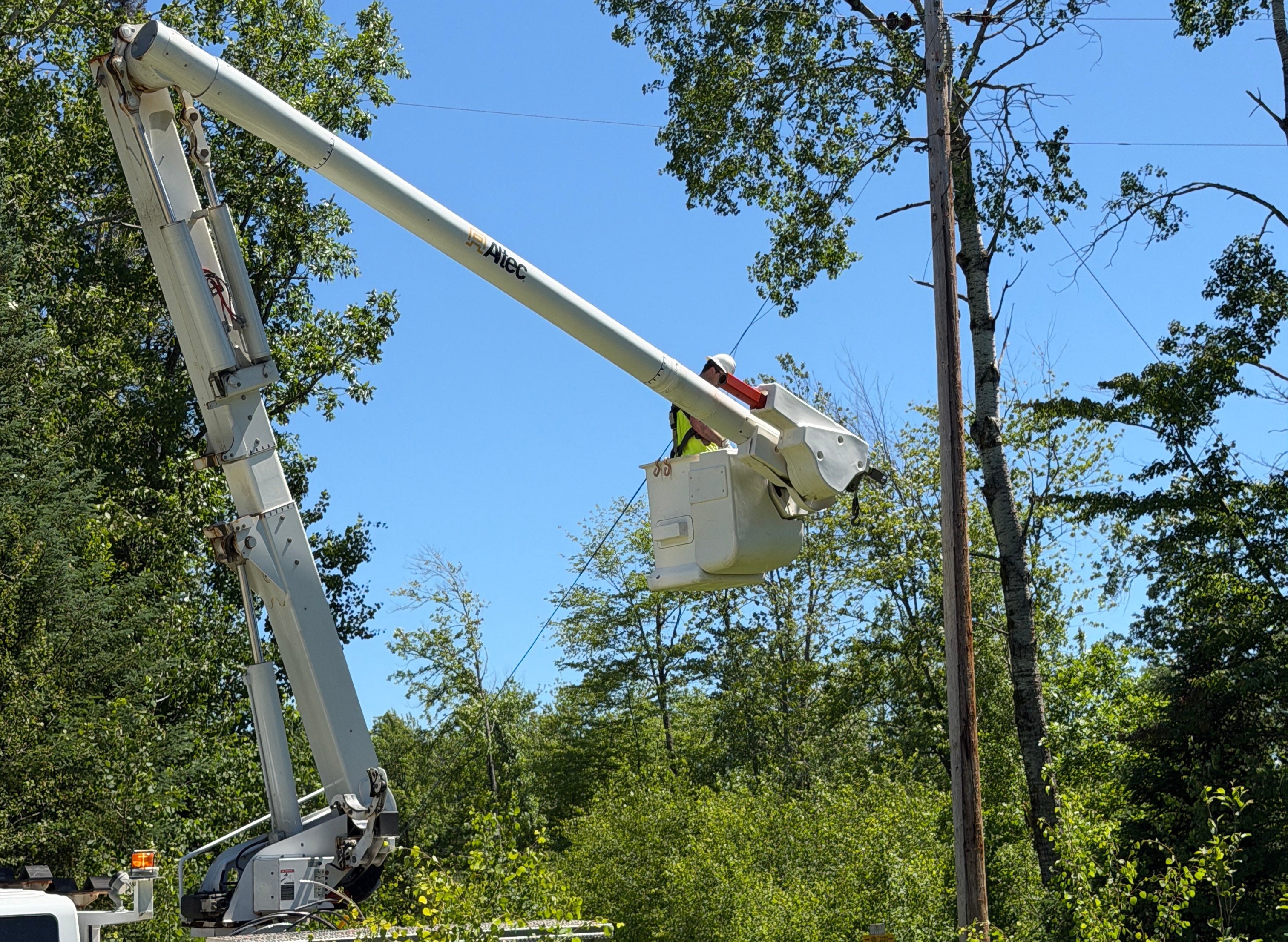 Man in bucket truck repairing a line